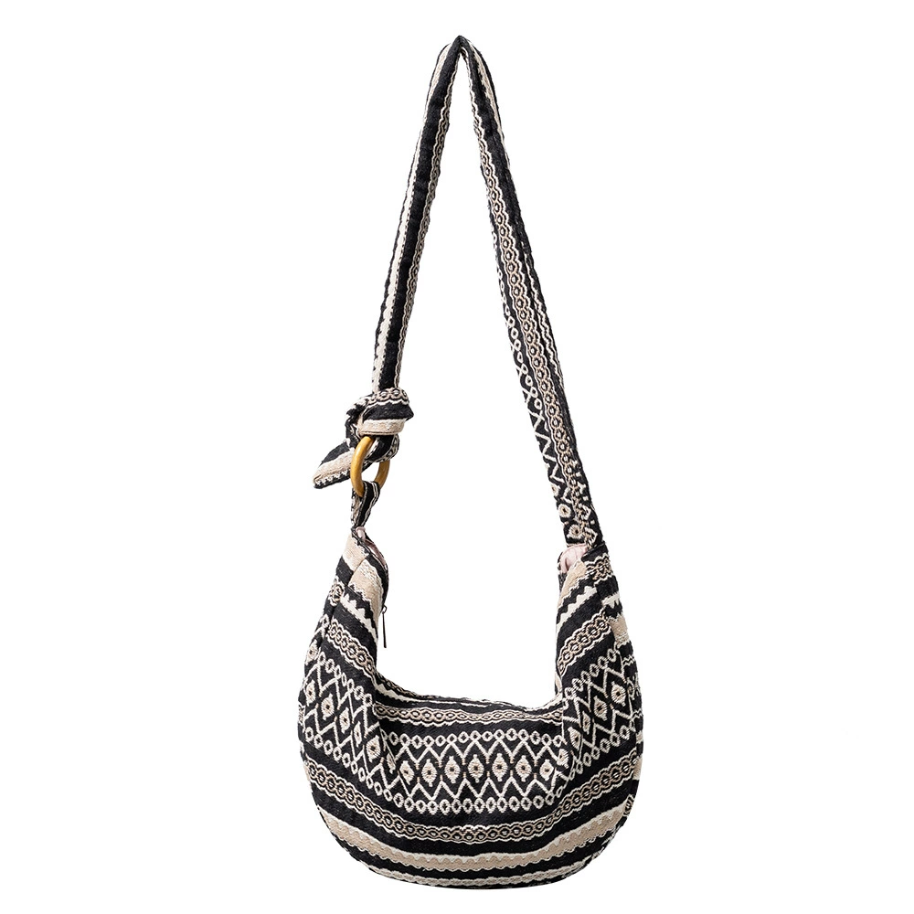 Handwoven Nomad Bag: handwoven detail of moon motifs texture