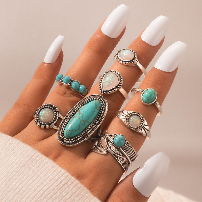 Turquoise Inlaid Carved Feather Ring Set: weekend market scene